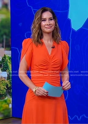 Rebecca Jarvis’s orange ruched front dress on Good Morning America