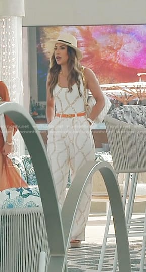 Taleen’s white chain print swimsuit and pants on The Real Housewives of Dubai