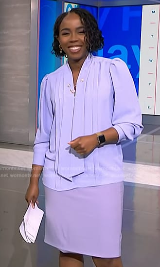 Zinhle’s lavender tie neck blouse and skirt on NBC News Daily