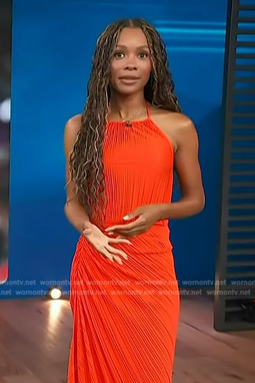 Zuri’s red pleated top and ruched skirt on Access Hollywood