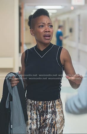Autumn’s black vest and abstract print pants on Reasonable Doubt