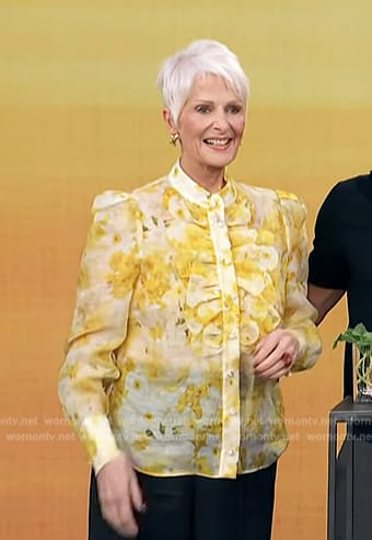 Christina Ferrare’s yellow floral print ruffle blouse on Access Hollywood