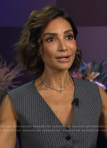 Courtney’s black pinstripe vest on E! News