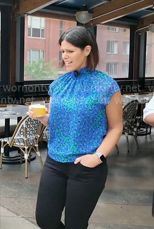 Dana Jacobson’s blue and green floral top on CBS Saturday Morning