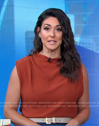 Erielle’s brown asymmetric top and belt on Good Morning America