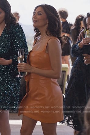 Eva’s orange leather dress on Only Murders in the Building