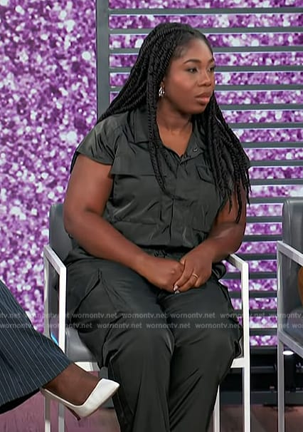 Lauren Smith’s black satin utility jumpsuit on Access Hollywood