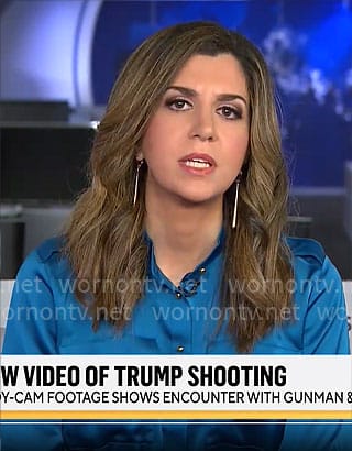 Nicole Sganga’s blue satin shirt on CBS Mornings
