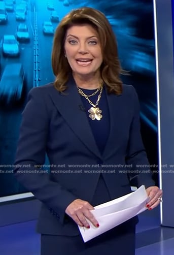 Norah’s navy peak lapel blazer on CBS Evening News