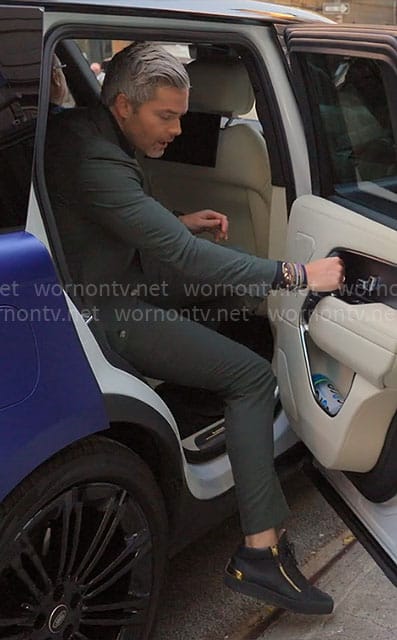 Ryan’s black and gold sneakers on Owning Manhattan