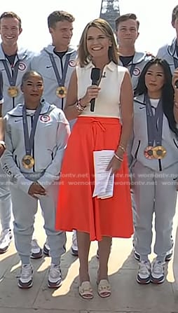 Savannah’s white zip front top and orange skirt on Today