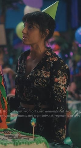 Lila’s black floral print wrap blouse on The Umbrella Academy