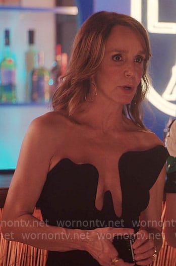 Sylvie’s black strapless dress on Emily in Paris
