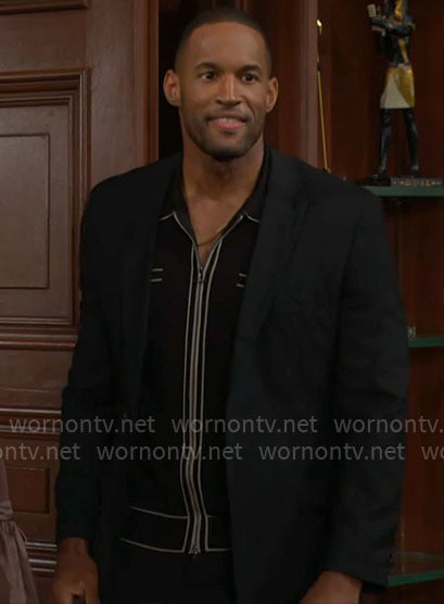 Carter’s black knit zip up shirt with white trims on The Bold and the Beautiful
