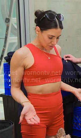 Chloe’s red asymmetric sports bra and bike shorts set on Owning Manhattan