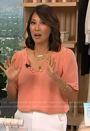 Diane’s orange eyelet top on Access Hollywood