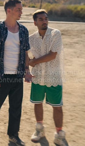 Dionysus’s floral lace shirt and green shorts on Kaos