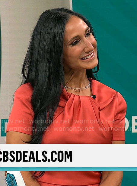 Elizabeth Werner’s short sleeved twist neck dress on CBS Mornings
