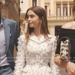 Emily’s white applique blazer and skirt suit on Emily in Paris