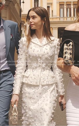 Emily’s white applique blazer and skirt suit on Emily in Paris