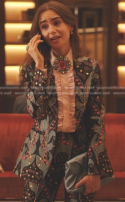 Emily’s print suit and pink brooch on Emily in Paris