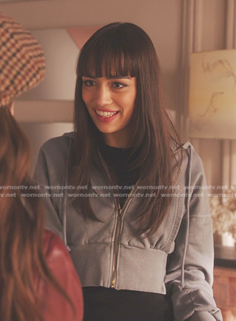 Genevieve’s grey cropped hoodie on Emily in Paris