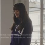 Genevieve’s purple NYU purple graphic hoodie on Emily in Paris