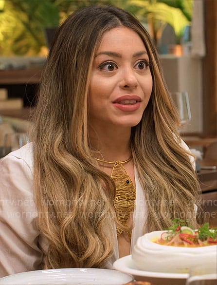 Jade’s gold fish necklace on Owning Manhattan