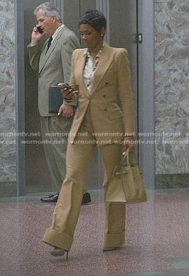 Jax’s floral blouse and beige suit on Reasonable Doubt