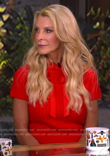 Joan Vasso’s red tie neck sweater top on The View