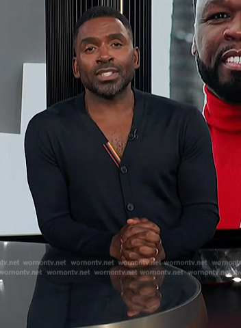 Justin’s black cardigan on E! News