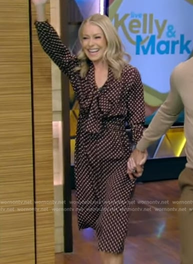 Kelly’s burgundy polka dot tie neck dress on Live with Kelly and Mark