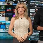Kit’s cable knit vest and leather mini skirt on Access Hollywood