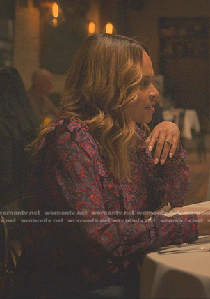 Sally’s purple floral ruffle blouse on Reasonable Doubt