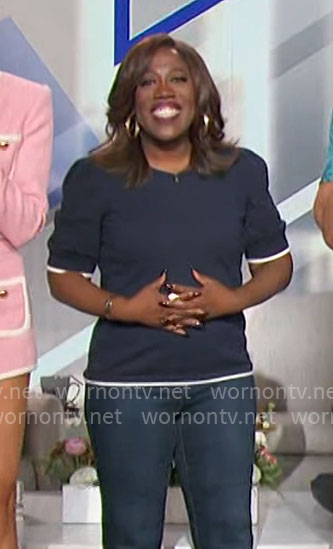 Sheryl’s navy top with white trim on The Talk