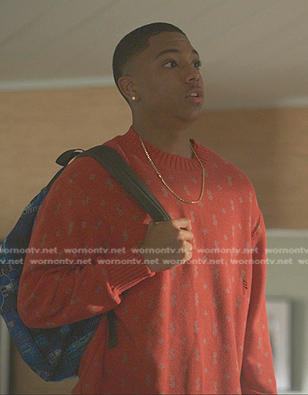 Spenser’s red printed knit sweater on Reasonable Doubt