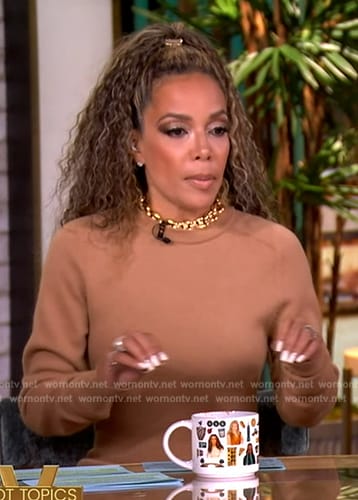Sunny’s beige chain neck sweater dress on The View