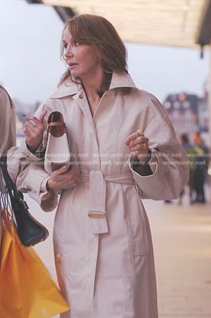 Sylvie’s beige belted coat on Emily in Paris