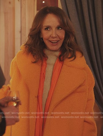 Sylvie’s orange fur coat on Emily in Paris
