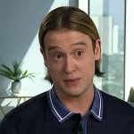 Tyler Henry’s navy contrast collar polo on E! News