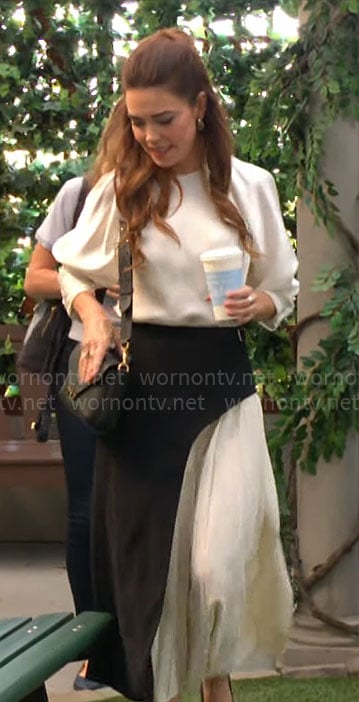 Victoria’s white blouse and black and white pleated skirt on The Young and the Restless