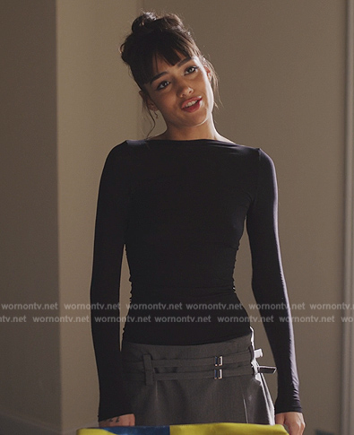 Genevieve’s gray buckle detail mini skort on Emily in Paris