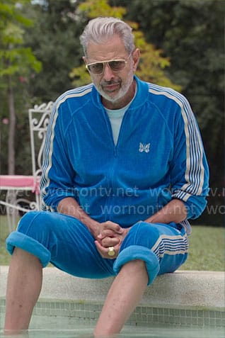 Zeus’s blue velour track suit with butterfly on Kaos