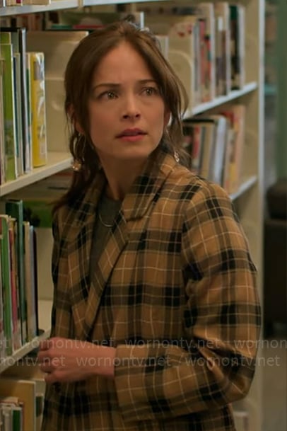 Cassandra’s camel plaid jacket on Murder in a Small Town