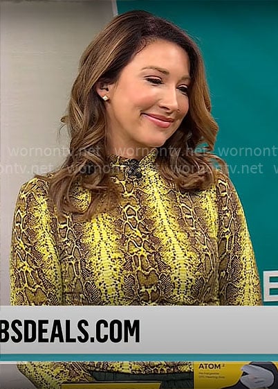 Courtney Cason’s yellow snake print top on CBS Mornings