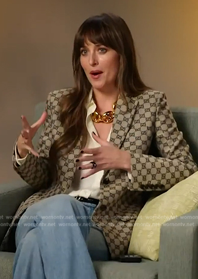 Dakota Johnson’s beige logo embroidered blazer on E! News