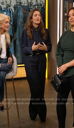 Drew’s’ black buckle detail pants and pumps on The Drew Barrymore Show