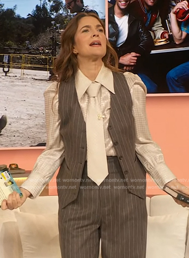 Drew’s white jacquard blouse and grey pinstripe vest on The Drew Barrymore Show
