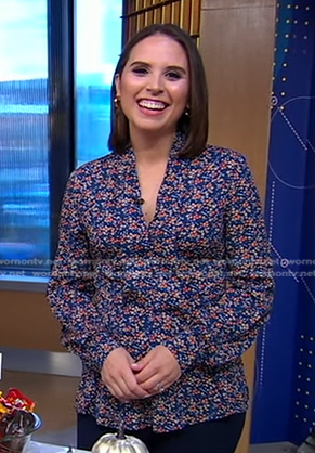 Elizabeth’s blue floral v-neck blouse on Good Morning America