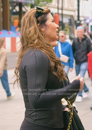 Emily’s black zip front jacket on The Real Housewives of Orange County